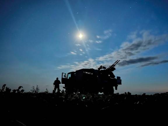 A serviceman from the mobile air defence unit of the 115th Separate Mechanized Brigade of the Ukrainian Armed Forces stands next to a ZU-23-2 anti-aircraft cannon during an overnight shift, amid Russia’s attack on Ukraine, in Kharkiv Region, Ukraine June 1, 2025. - REUTERS/Sofiia Gatilova