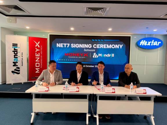 Launching the innovative product. (From left): Hextar Technologies Solutions Bhd deputy CEO Choo Joon Keong, Ong, Mandrill Tech Sdn Bhd CEO Davent Low Chan Phan and head of innovation Chong Kok Weng.