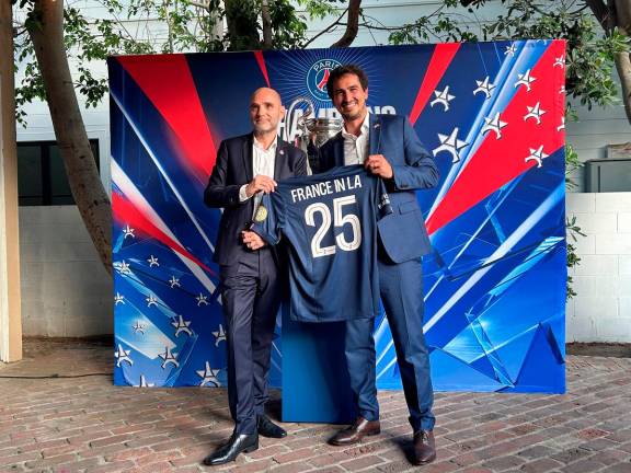 Paris St Germain CEO Victoriano Melero and Adrien Frier, the French consul-general in Los Angeles, pose for a picture in Beverly Hills, U.S., June 12, 2025. - REUTERS/Rory Carroll