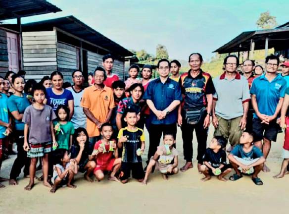 - Senator Abun Sui Anyit (in blue shirt) visiting folks in Ulu Belaga. - Pic courtesy of Abun Sui’s office