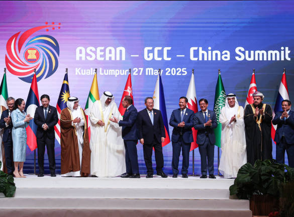 Malaysian Prime Minister Datuk Seri Anwar Ibrahim chats with leaders of ASEAN, China and the Gulf Cooperation Council (GCC) during a photo session prior to convening for the ASEAN-GCC-China Summit at the Kuala Lumpur Convention Centre. - BERNAMApix