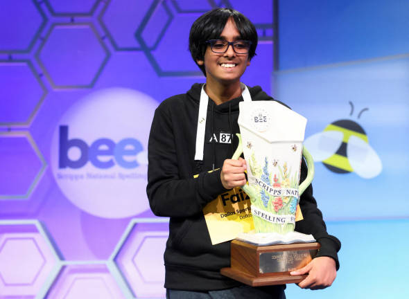 Faizan Zaki, 13, of Dallas, Texas, holds the prize after winning the annual Scripps National Spelling Bee in National Harbor, Maryland, U.S., May 29, 2025. - REUTERSpix