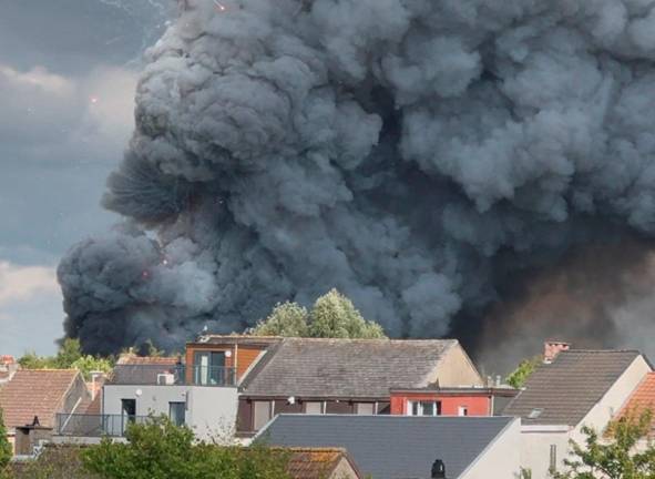Fireworks burst and smoke rises as a fire engulfs the main stage of Tomorrowland, an electronic music event, in Boom, Belgium, July 16, 2025 in this still image from social media video. Morgan Hermans via REUTERS THIS IMAGE HAS BEEN SUPPLIED BY A THIRD PARTY.