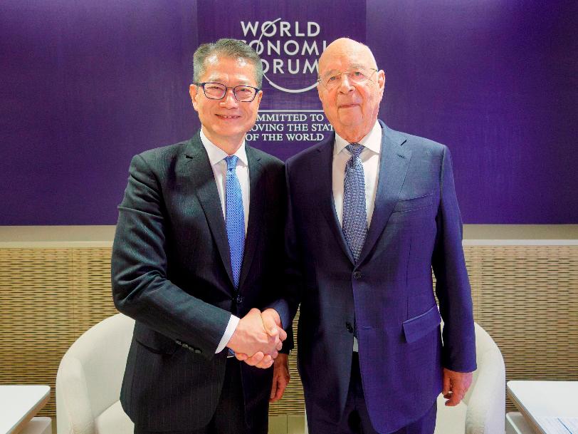 $!Mr Chan (left) meeting with the founder and executive chairman of the World Economic Forum, Professor Klaus Schwab.