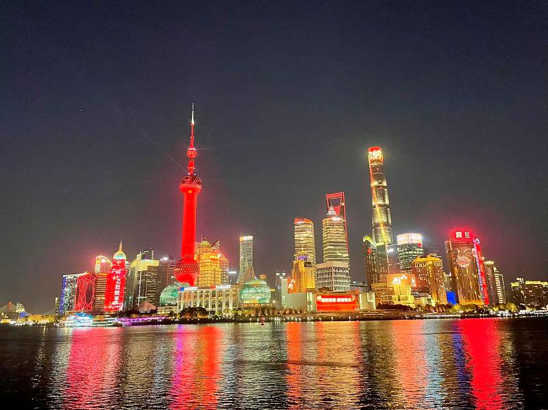 View of the Lujiazui skyline as Shanghai Oriental Pearl Tower lights up in red in the evening on January 28, 2025.