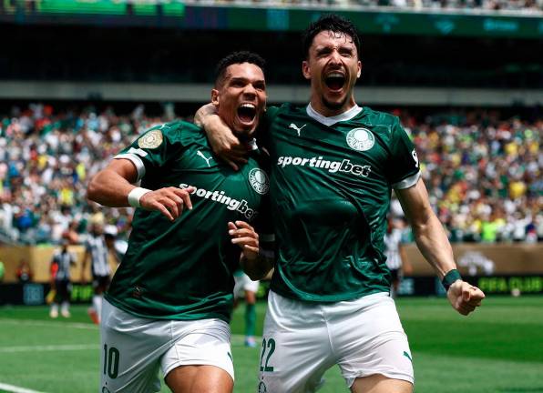 Palmeiras’ Paulinho celebrates scoring their first goal with Joaquin Piquerez REUTERS/Lee Smith TPX IMAGES OF THE DAY