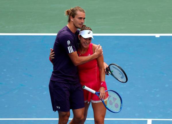 Germany’s Alexander Zverev and Switzerland’s Belinda Bencic react after losing their round of 16 mixed doubles match against Christian Harrison of the U.S. and Danielle Collins of the U.S. REUTERS/Kylie Cooper