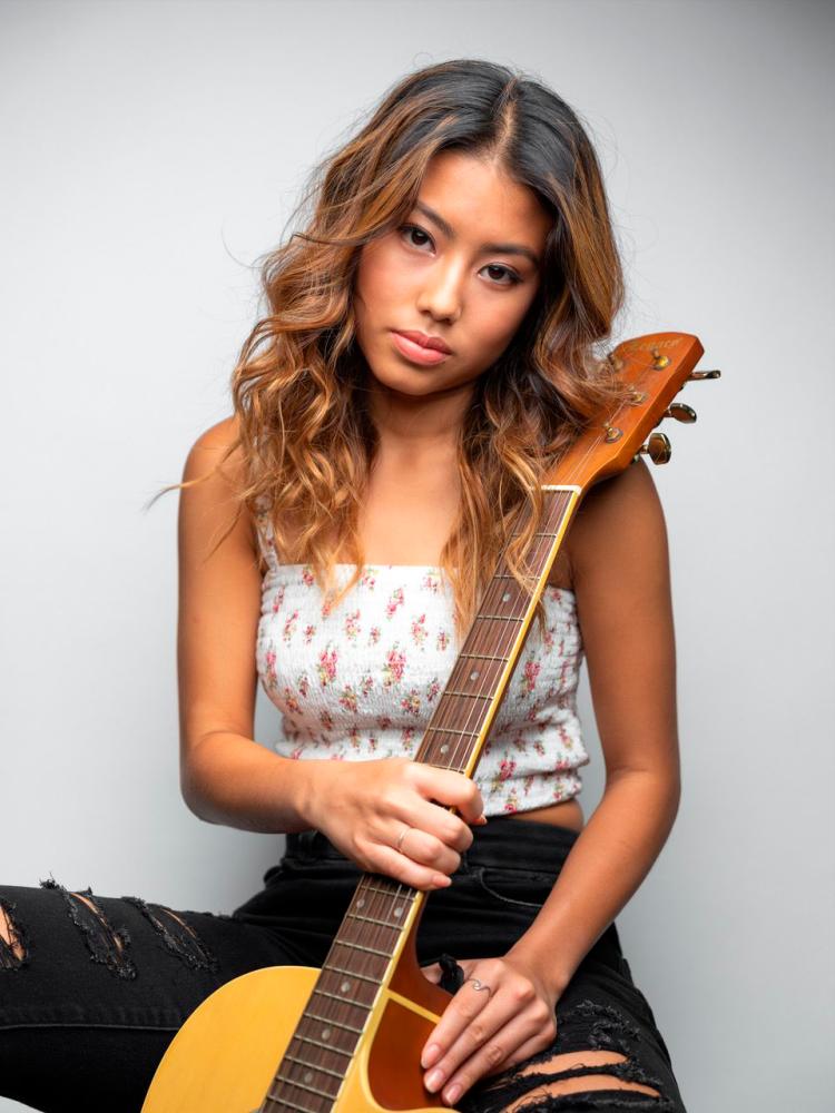 $!Musically inclined since young, Kat plays the violin, piano and guitar superbly