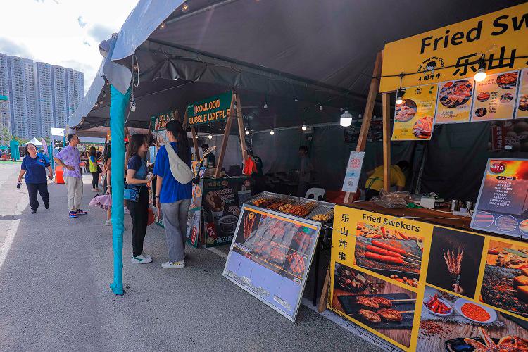 $!Over 30 food stalls and trucks provide quick bites for visitors who attended the event.