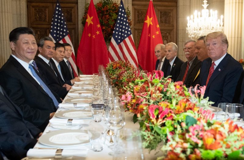US President Donald Trump (R) Secretary of State Mike Pompeo (2R) and delegation members hold a dinner meeting with China’s President Xi Jinping (L) Foreign Affairs Minister Wang Yi (2nd L) and Chinese government representatives after the G20 summit. — AFP