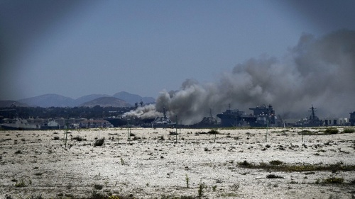 Fire crews battle San Diego ship fire. -Reuters