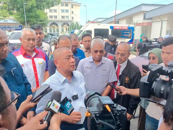 Perak Menteri Besar Datuk Seri Saarani Mohamad speaking to reporters near the Hospital Raja Permaisuri Bainun’s mortuary following the Gerik bus crash today. - Sunpix