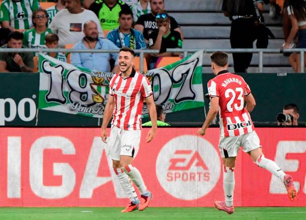 Athletic Bilbao’s defender Aitor Paredes celebrates scoring his team’s second goal during the Spanish league football match between Real Betis and Athletic Club Bilbao at the Cartuja stadium in Seville, on August 31, 2025. - AFP