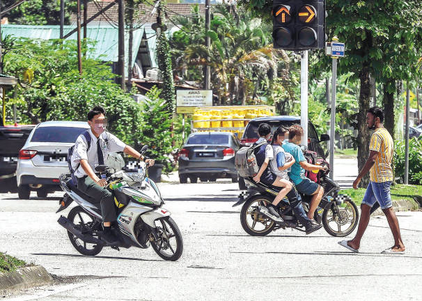 The department said despite existing regulations, teenagers and adults continue to ride motorcycles without helmets in neighbourhoods. – theSunpix
