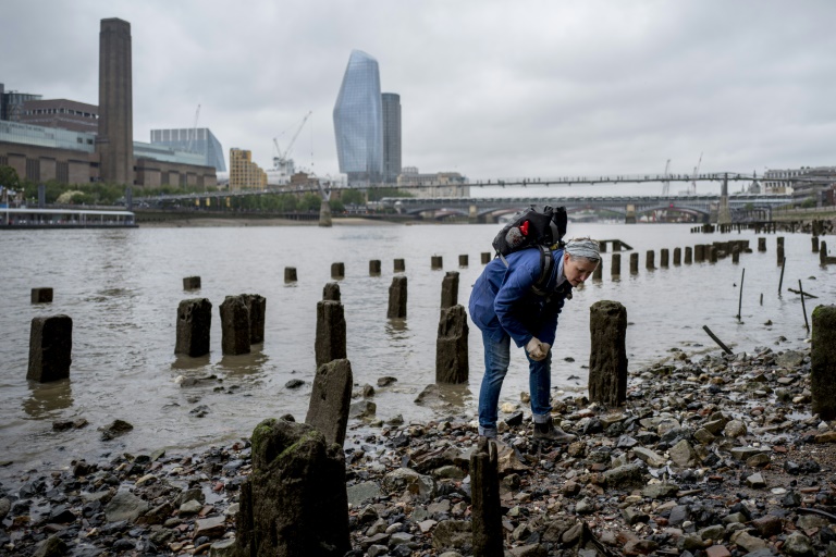 ‘Mudlarks’ like Lara Maiklem scour the shores of the River Thames in London for historical items. — AFP