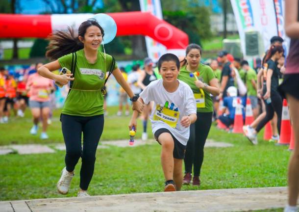 Differently-abled runners at the event were supported by 54 volunteer running mentors. – AMIRUL SYAFIQ/THESUN