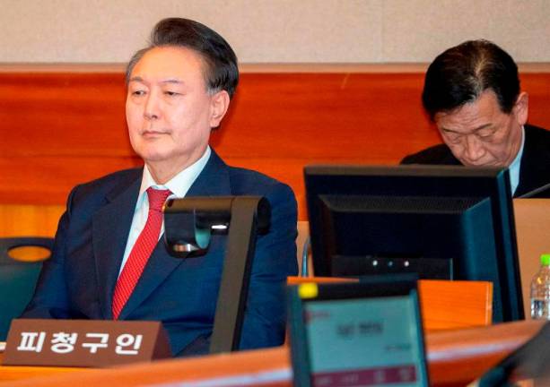 South Korea’s impeached President Yoon Suk Yeol attends the hearing of his impeachment trial over his short-lived imposition of martial law, at the Constitutional Court in Seoul, South Korea, February 20, 2025. - SONG KYUNG-SEOK/Pool via REUTERS