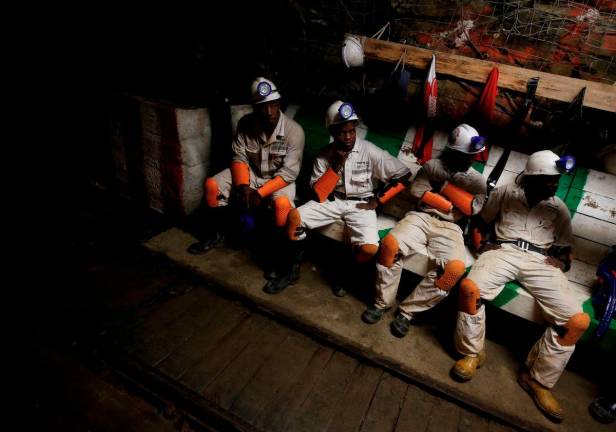 Miners take a break in a waiting area deep underground at Sibanye Gold’s Masimthembe shaft in Westonaria, South Africa, April 3, 2017. - REUTERSpix