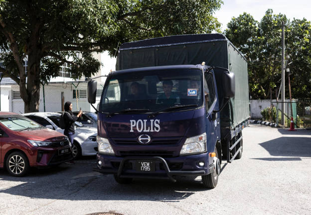 The police vehicle carrying the remains of the UPSI students involved in the fatal accident in Gerik earlier this morning has arrived at the Forensic Department of Hospital Raja Permaisuri Bainun. - BERNAMApix