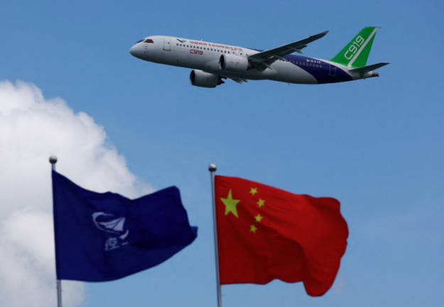 A Comac C919 flies during an aerial display at the Singapore Airshow at Changi Exhibition Centre, in Singapore, February 20, 2024. - REUTERSpix