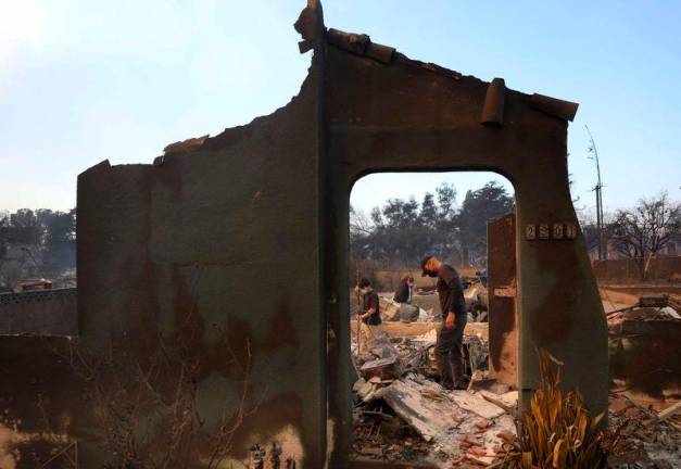 Residents dig through the remains of their family’s home that was destroyed by the Eaton Fire on January 09, 2025 in Altadena, California. AFPpix