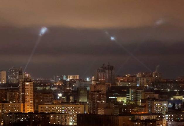 Ukrainian service personnel use searchlights as they search for drones in the sky over the city during a Russian drone strike, amid Russia’s attack on Ukraine, in Kyiv, Ukraine March 18, 2025. REUTERSpix