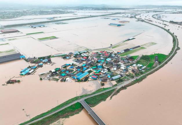 An aerial view of flooding caused by torrential rain in Yesan, South Korea, July 17, 2025. Yonhap via REUTERS PIX