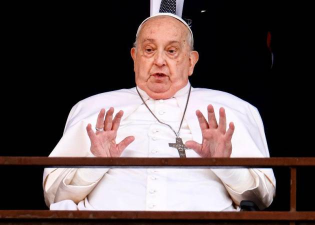 Pope Francis gestures during his first public appearance in five weeks, on the day he is set to be discharged from Gemelli Hospital, in Rome, Italy, March 23, 2025. - REUTERS/Yara Nardi