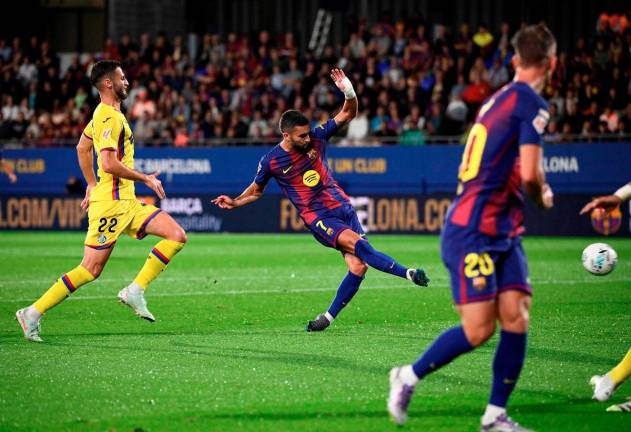 Barcelona’s forward Ferran Torres scores his team’s first goal during the Spanish league football match between FC Barcelona and Getafe CF at Johan Cruyff Stadium in Barcelona on September 21, 2025. - AFP
