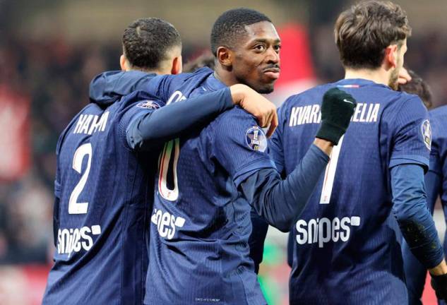 Paris Saint-Germain's French forward #10 Ousmane Dembele (C) celebrates after scoring a goal during the French L1 football match between Stade Brestois 29 (Brest) and Paris Saint-Germain (PSG) at Stade Francis-Le Ble in Brest, western France, on February 1, 2025. - Fred TANNEAU / AFP