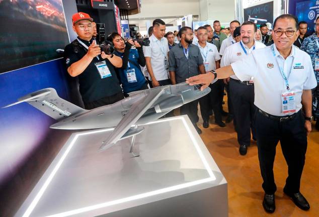 Mohamed Khaled visiting a booth at the Mahsuri International Exhibition Centre in Langkawi yesterday. – ADAM AMIR HAMZAH/THESUN