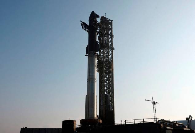 SpaceX’s Super Heavy booster is seen on the launch pad, with Starship atop as it is prepared for its ninth mission targeted for May 27 from the company’s Starbase launchpad on an uncrewed test flight, in Starbase, Texas, U.S. May 26, 2025. REUTERS/Joe Skipper