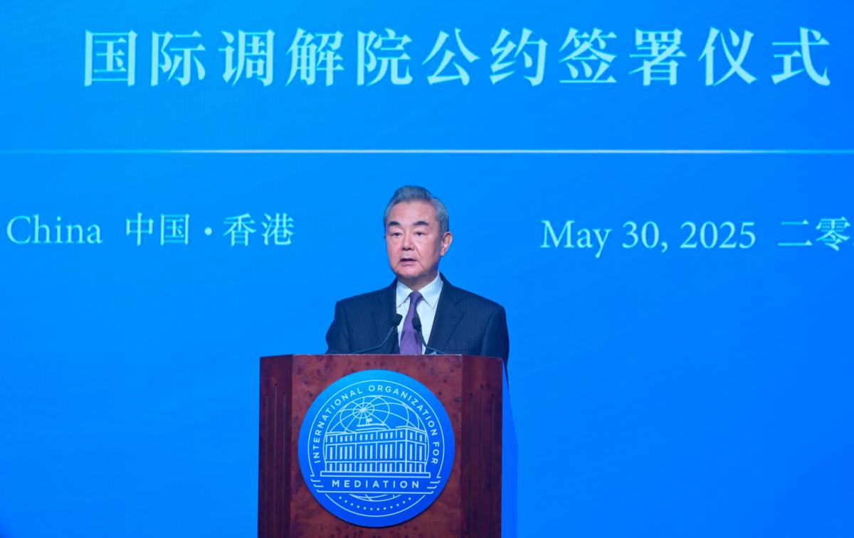 Member of the Political Bureau of the Communist Party of China Central Committee and Minister of Foreign Affairs of the People’s Republic of China, Wang Yi, speaks at the Signing Ceremony of the Convention on the Establishment of the International Organization for Mediation and is the first to sign the Convention on behalf of China.