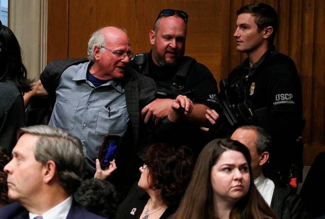 Ben Cohen, co-founder of ice cream company Ben &amp; Jerry’s, is removed by U.S. Capitol Police, as U.S. Health and Human Services (HHS) Secretary Robert F. Kennedy Jr. (Not Pictured) testifies before a Senate Health, Education, Labor &amp; Pensions Committee hearing on the Department of Health and Human Services budget, on Capitol Hill in Washington, D.C., U.S., May 14, 2025. REUTERSpix