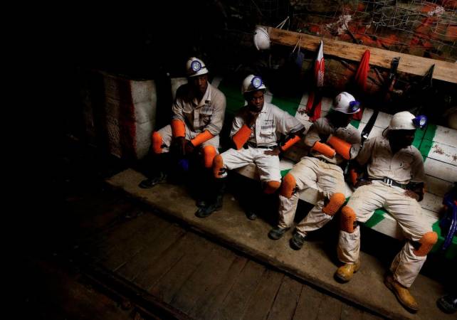 Miners take a break in a waiting area deep underground at Sibanye Gold’s Masimthembe shaft in Westonaria, South Africa, April 3, 2017. - REUTERSpix