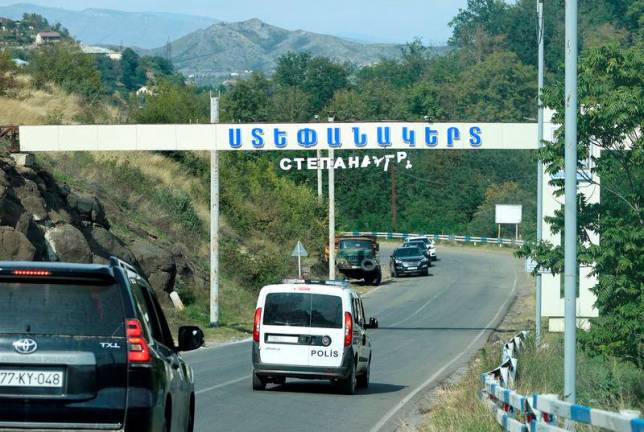 A view through a car window shows a damaged entrance sign of Stepanakert city, known as Khankendi by Azerbaijan, following a military operation conducted by Azeri armed forces and a further mass exodus of ethnic Armenians from the region of Nagorno-Karabakh.REUTERSpix