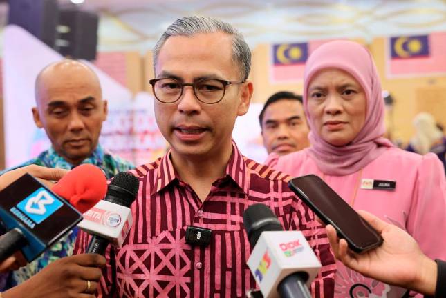 Communications Minister Datuk Fahmi Fadzil (centre) speaking during a press conference at the National Storytelling Finals @My Malaysia Club Competition at Menara Komunikasi, Putrajaya earlier.- Bernama pic