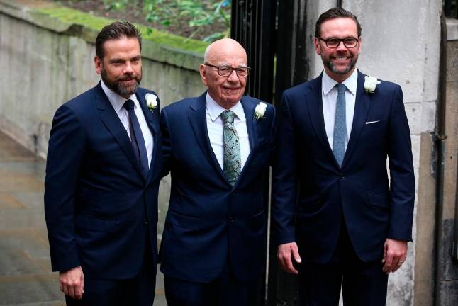 Australian born media magnate Rupert Murdoch (C) flanked by his sons Lachlan (L) and James (R) arrive at St Bride’s church on Fleet Street in central London on March 5, 2016, to attend a ceremony of celebration a day after the official marriage of Rupert Murdoch and former US model Jerry Hall. - AFP file pic