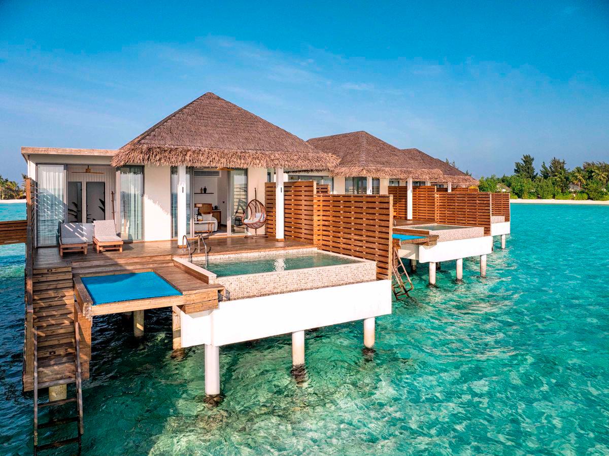 The resort’s overwater villas are thoughtfully designed for modern comfort and privacy, offering seamless indoor-outdoor living, spacious decks, and inviting plunge pools.