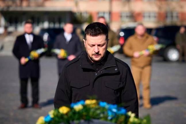 Ukrainian President Volodymyr Zelensky honouring the memory of fallen Ukrainian fighters at the Lychakiv Cemetery in Lviv, amid the Russian invasion of Ukraine. AFPpix