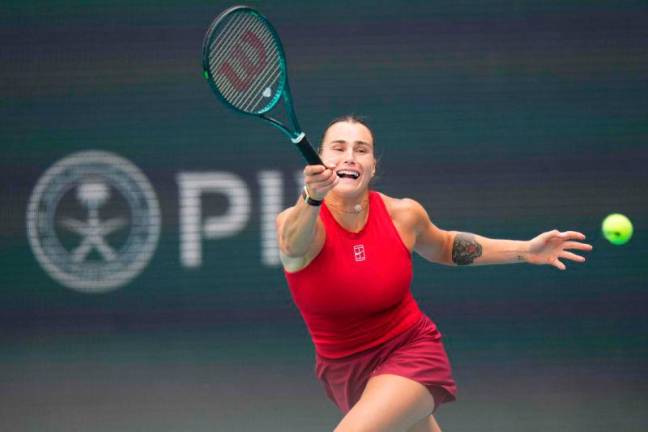 Aryna Sabalenka returns a shot against Elena-Gabriela Ruse of Romania during their match on day 4 at Hard Rock Stadium on March 22, 2025 AFPpix