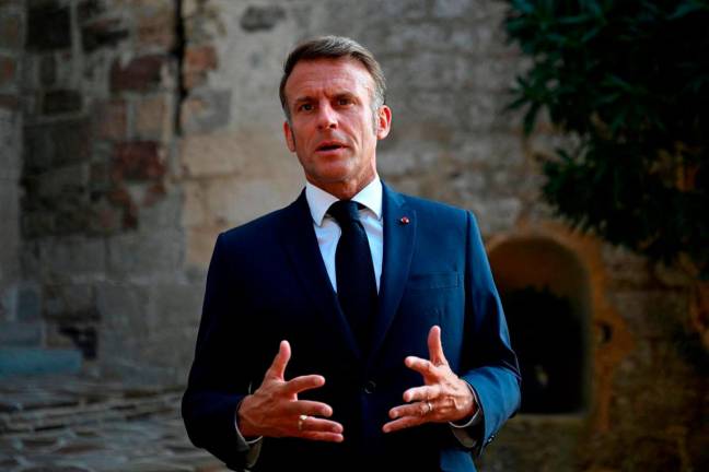 French President Emmanuel Macron in Bormes-les-Mimosas, southern France on Aug 17, 2025. - Philippe Magoni/Pool via REUTERSPIX