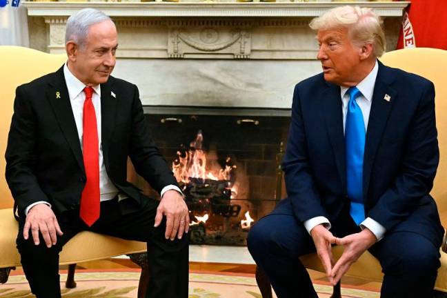 US President Donald Trump (R) meets with Israel’s Prime Minister Benjamin Netanyahu in the Oval Office of the White House in Washington, DC, on February 4, 2025. - ANDREW CABALLERO-REYNOLDS / AFP