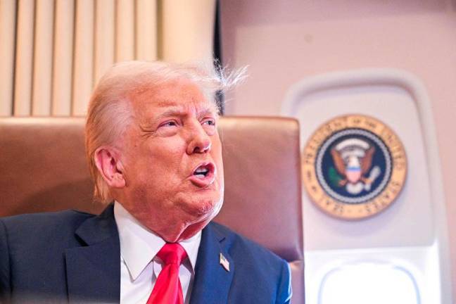 US President Donald Trump speaks to the press before signing a proclamation renaming the Gulf of Mexico as the Gulf of America aboard Air Force One at Palm Beach International Airport in West Palm Beach, Florida, on Febrary 09, 2025. For years, as disputes over names on the map riled up nationalist passions in several parts of the world, US policymakers have watched warily, trying to stay out or to quietly encourage peace. Suddenly, the United States has gone from a reluctant arbiter to a nomenclature belligerent, as President Donald Trump declared that the Gulf of Mexico will henceforth be called the “Gulf of America.” In an executive order signed hours after he returned to the White House, Trump called the water body an “indelible part of America” critical to US oil production and fishing and “a favorite destination for American tourism and recreation activities.” - ROBERTO SCHMIDT / AFP