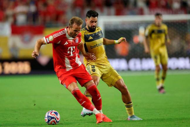 Harry Kane of FC Bayern Munchen controls the ball under pressure from Milton Gimenez of CA Boca Juniors during the FIFA Club World Cup 2025 group C match between FC Bayern München and CA Boca Juniors at Hard Rock Stadium on June 20, 2025 in Miami Gardens, Florida - AFPpix