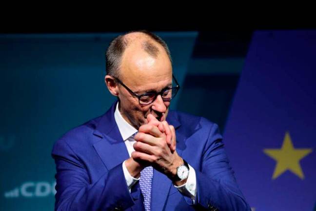 The leader and top candidate for Chancellor of Germany's Christian Democratic Union (CDU) Friedrich Merz gestures on stage during a campaign event at the Ostra-Dome in Dresden, eastern Germany, on January 30, 2025, ahead of parliamentary elections due to take place on February 23, 2025. AFPpix