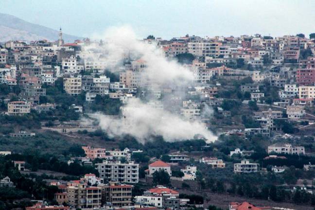 Smoke billows from the site of an Israeli strike that targeted the southern Lebanese village of Khiam on September 22, 2024. The Israeli army said that more than 100 projectiles were fired from Lebanon on September 22 and in response to the incoming fire from Hezbollah, it had launched new strikes on the group’s targets in southern Lebanon. - AFPpix