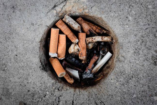 From July 1, 2025 smoking will be banned on beaches as France brings in a smoking ban for all outdoor places that can be frequented by children. Photo by JOEL SAGET / AFP)