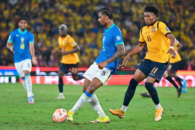 Brazil’s defender #03 Alexsandro Ribeiro and Ecuador’s forward #11 Kevin Rodriguez fight for the ball during the 2026 FIFA World Cup South American qualifiers football match between Ecuador and Brazil at the Monumental Banco Pichincha stadium in Guayaquil, province of Guayas, Ecuador on June 5, 2025. AFP