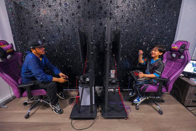 Mika said despite the age difference, Zaba pulls no punches when they engage in gaming sessions. – Adib Rawi Yahya/theSun